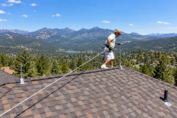 Lightning Rod Installer on Roof on a Colorado Home Lightning Rod Installer on Roof on a Colorado Home